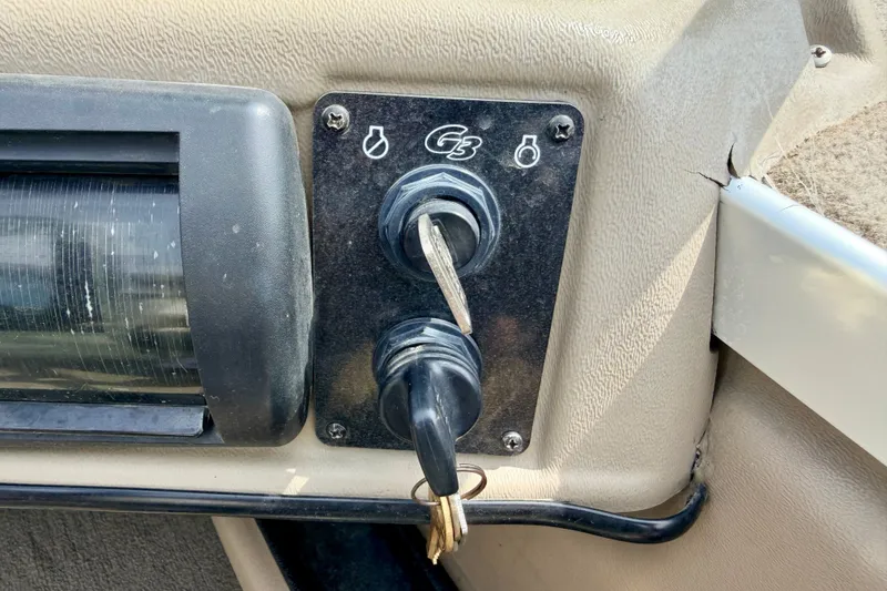 Slide: The Image of Control panel of a 2008 G3 Angler V185 FS boat with ignition key. - 41
