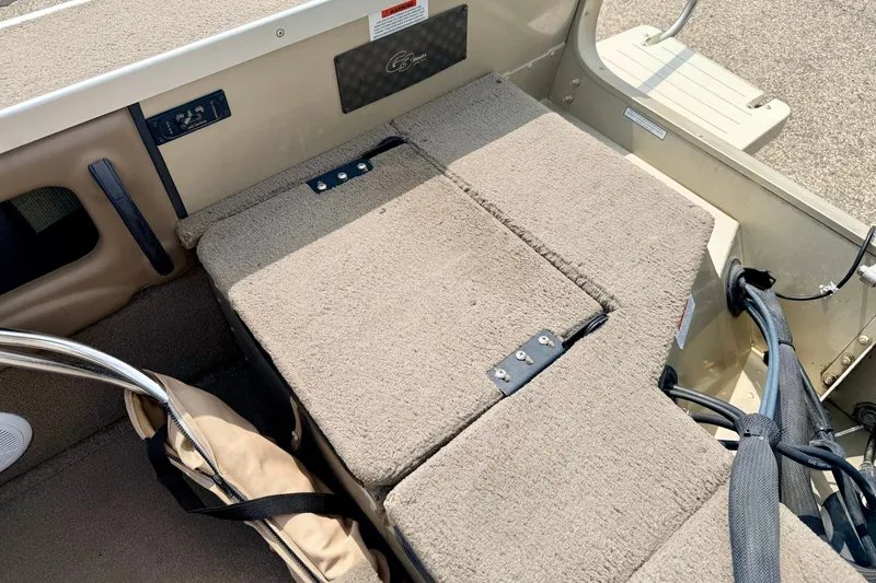 Slide: The Image of Interior of 2008 G3 Angler V185 FS boat with cushioned seating and storage. - 28
