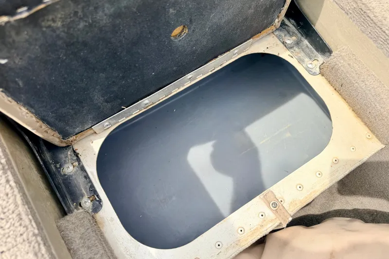 Slide: The Image of Open storage compartment in 2008 G3 Angler V185 FS boat interior. - 77
