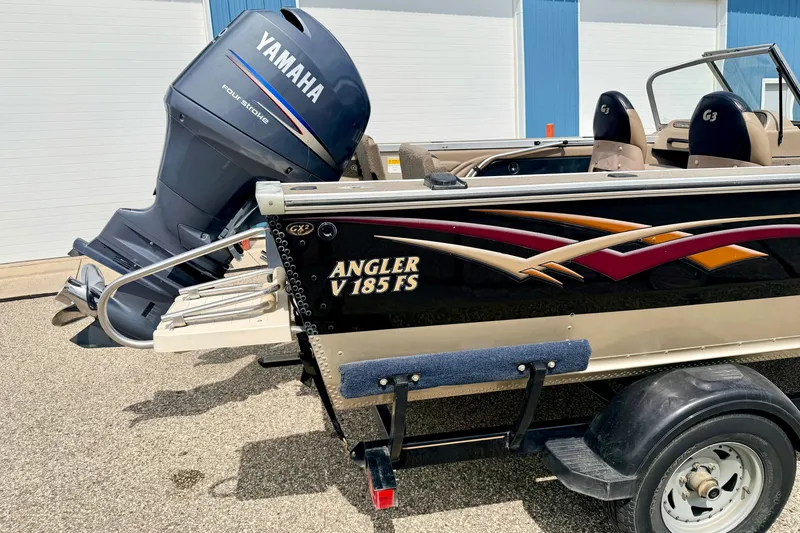 Slide: The Image of 2008 G3 Angler V185 FS boat with Yamaha four-stroke engine, parked on trailer. - 23