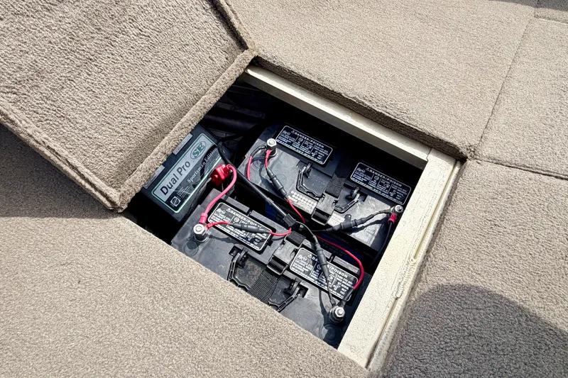 Slide: The Image of 2008 G3 Angler V185 FS boat battery compartment with Dual Pro charger. - 60
