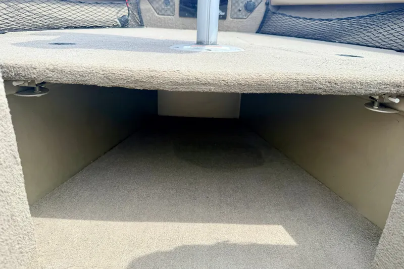 Slide: The Image of 2008 G3 Angler V185 FS boat storage compartment with carpeted interior. - 70