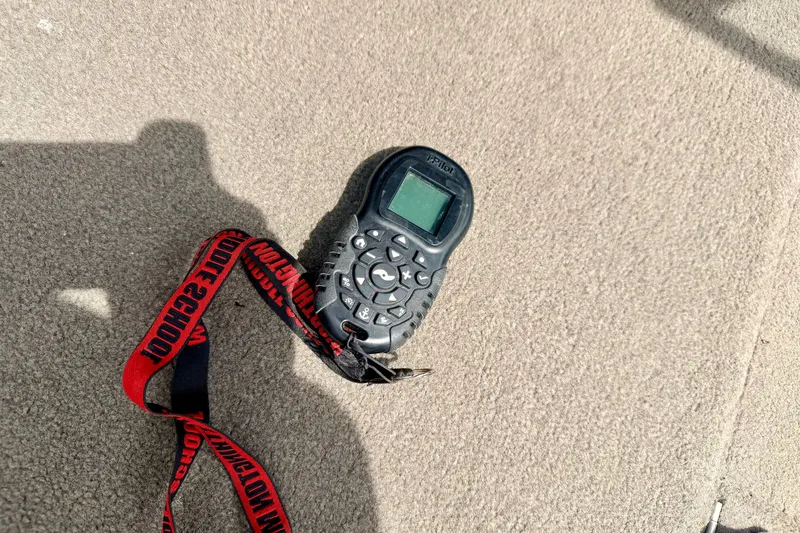Slide: The Image of Remote control with lanyard on boat carpet, G3 Angler V185 FS, 2008 model. - 48