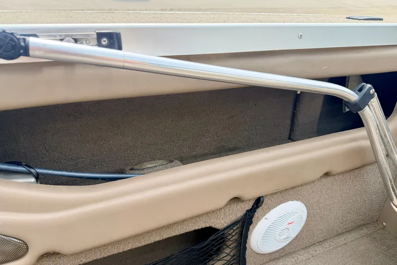 Slide: The Image of Interior view of a 2008 G3 Angler V185 FS boat, featuring storage compartment and speaker. - 78