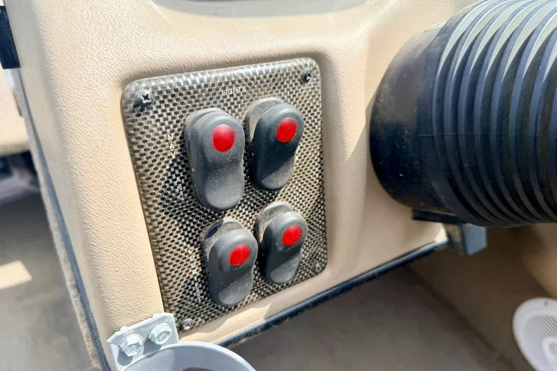 Slide: The Image of Control panel of a 2008 G3 Angler V185 FS boat with red-button switches. - 39