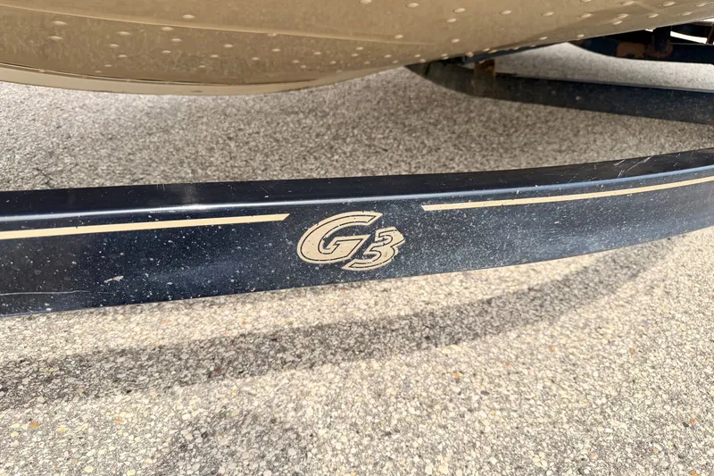 Slide: The Image of 2008 G3 Angler V185 FS boat trailer detail on pavement. - 81