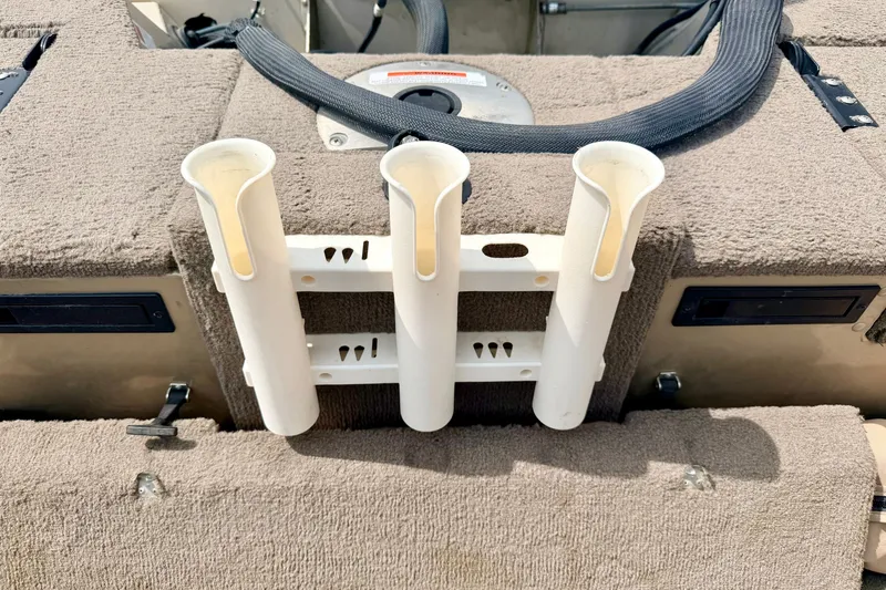Slide: The Image of 2008 G3 Angler V185 FS boat interior with rod holders and carpeted surface. - 33