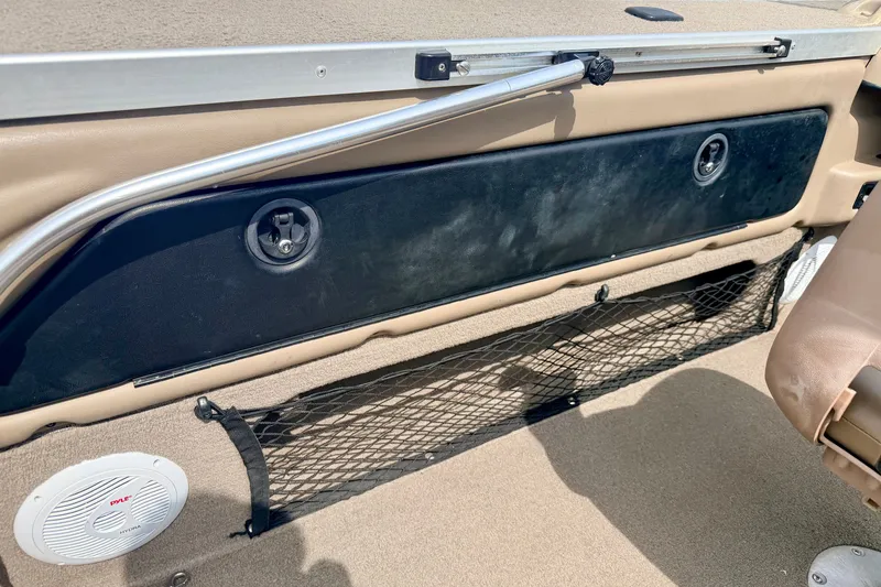 Slide: The Image of 2008 G3 Angler V185 FS boat interior with storage compartment and speaker. - 36