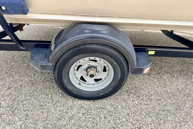 Slide: The Image of Trailer wheel of 2008 G3 Angler V185 FS boat on pavement. - 83