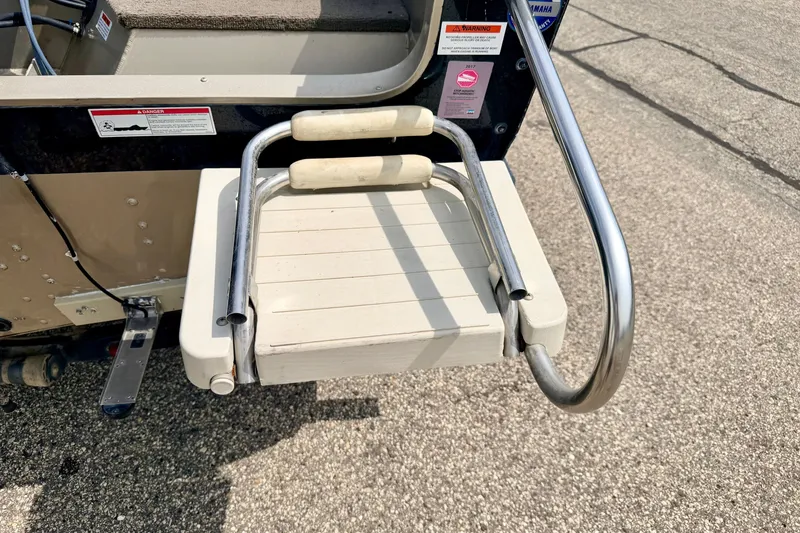 Slide: The Image of 2008 G3 Angler V185 FS boat ladder with stainless steel rails and non-slip steps. - 22