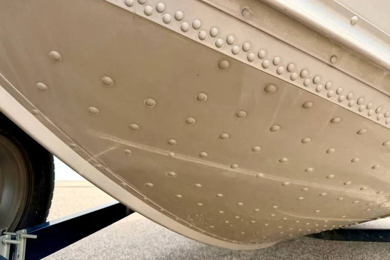 Slide: The Image of Close-up of 2008 G3 Angler V185 FS boat hull with rivet details. - 79