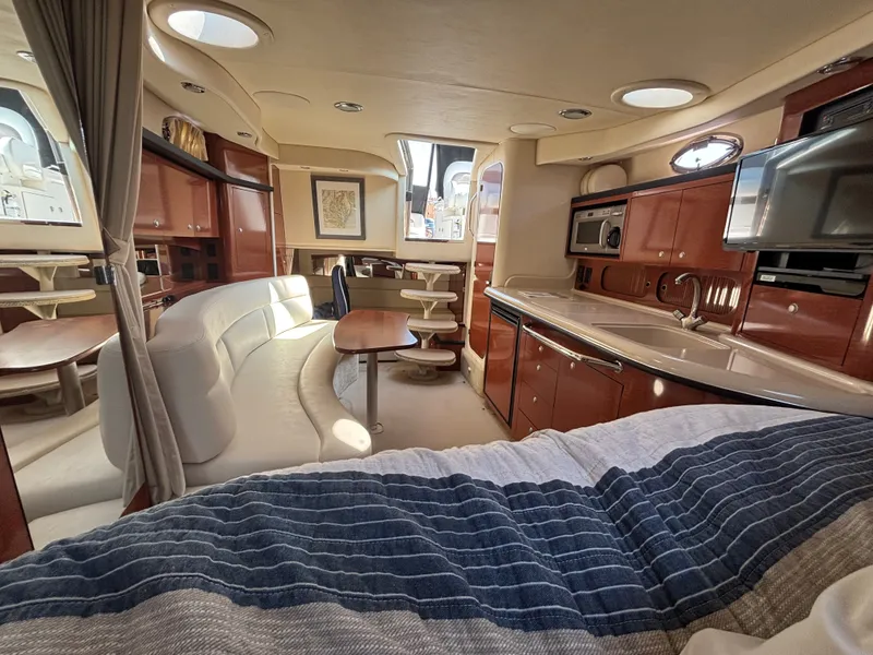 Slide: The Image of Interior of a 2005 Sea Ray 340 Sundancer with elegant furnishings and modern amenities. - 16