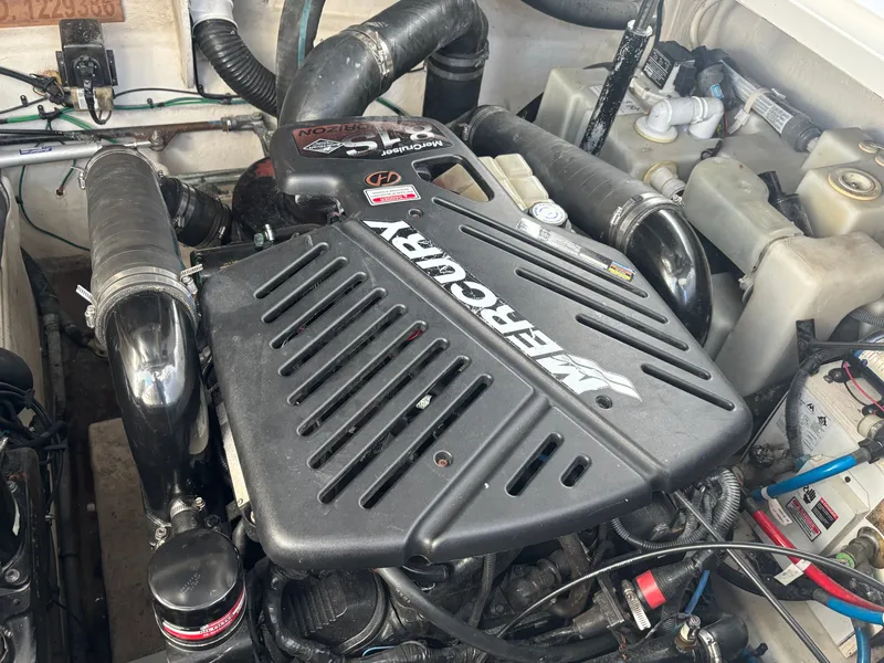 Slide: The Image of Engine compartment of a 2005 Sea Ray 340 Sundancer with a Mercury engine. - 20