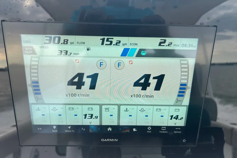 Slide: The Image of Garmin display on 2025 Sportsman Open 262 Center Console showing speed and fuel data. - 15