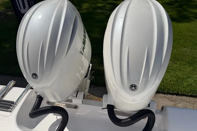 Slide: The Image of Twin Yamaha outboard engines on a 2025 Sportsman Open 262 Center Console boat. - 35