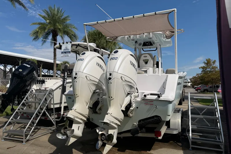 Slide: The Image of 2025 Sportsman Open 262 Center Console boat with twin Yamaha 200 engines. - 33
