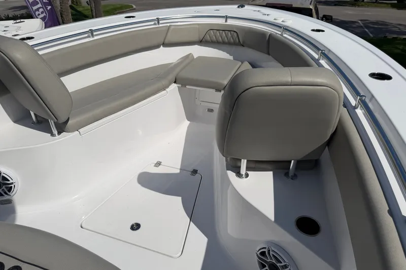 Slide: The Image of 2025 Sportsman Open 262 Center Console boat interior with cushioned seating. - 23