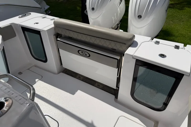 Slide: The Image of 2025 Sportsman Open 262 Center Console boat interior with seating and storage compartments. - 27
