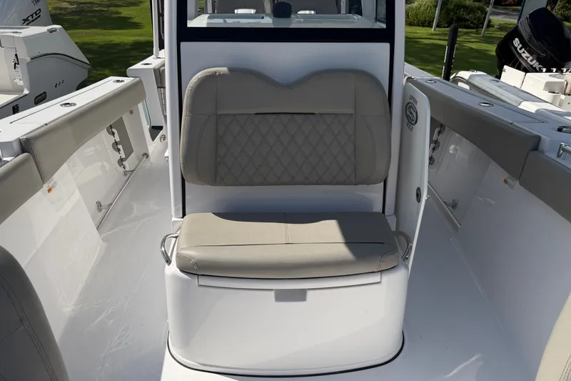 Slide: The Image of 2025 Sportsman Open 262 Center Console boat interior with cushioned seating. - 25