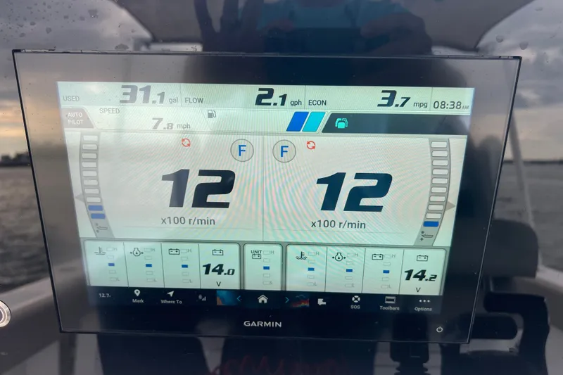 Slide: The Image of Garmin display on 2025 Sportsman Open 262 Center Console showing fuel and engine data. - 16