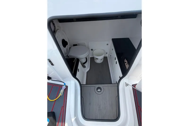 Slide: The Image of Interior view of 2026 Monterey Elite 27 SD boat bathroom with modern amenities. - 16