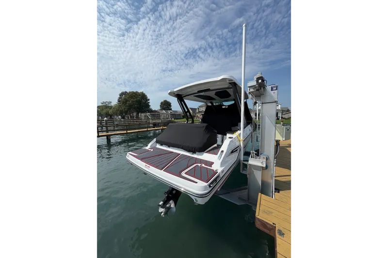 Slide: The Image of 2026 Monterey Elite 27 SD boat docked on a sunny day with clear skies. - 17
