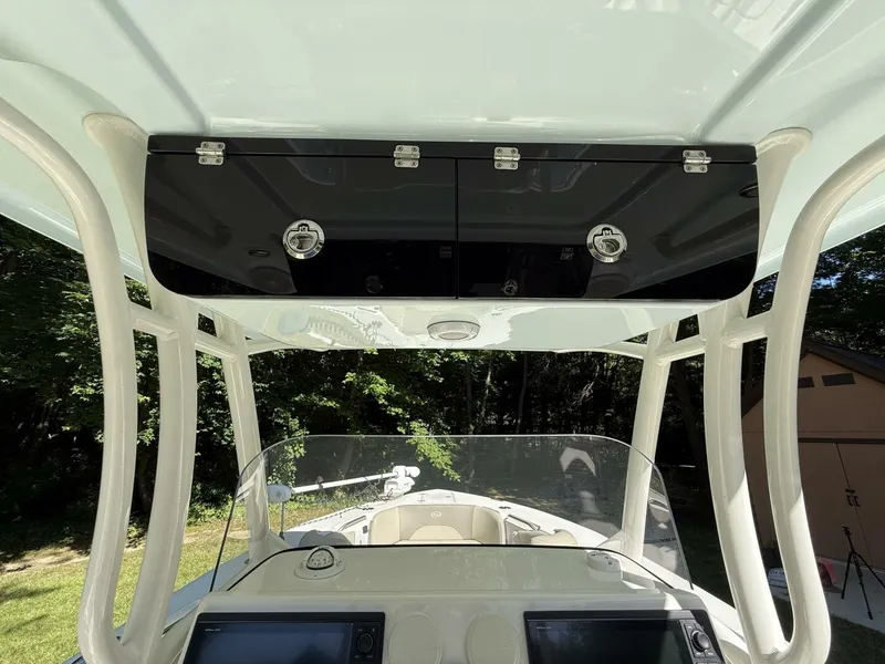 Slide: The Image of The image shows the cockpit of a Key West 263 FS boat with a modern helm station. - 26