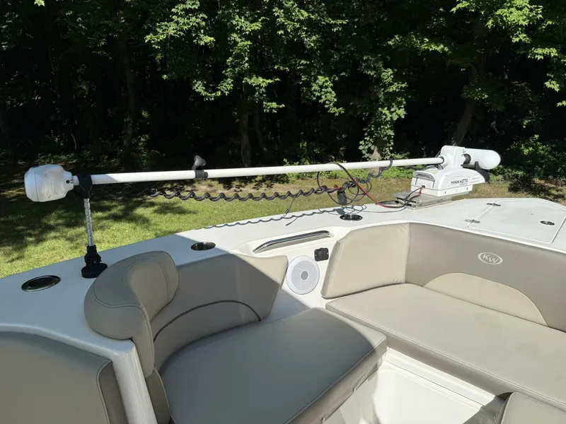 Slide: The Image of The image shows the deck of a 2023 Key West 263 FS boat with comfortable seating. - 30