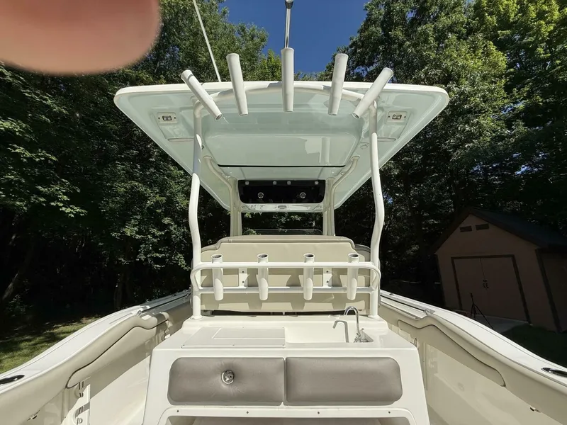 Slide: The Image of The image shows the cockpit of a 2023 Key West 263 FS boat with a T-top. - 15