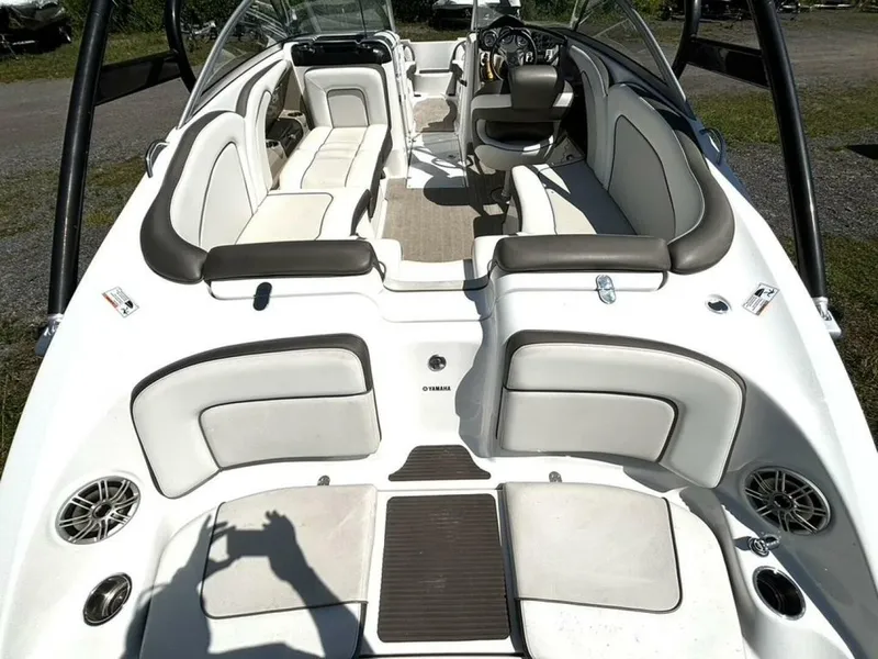 Slide: The Image of The image shows the spacious cockpit of a 2013 Yamaha 242 Limited S boat. - 13