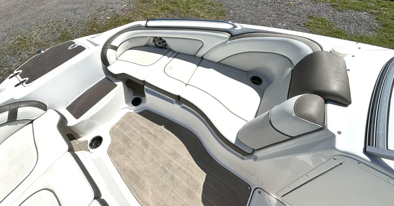 Slide: The Image of The image shows the cockpit of a 2013 Yamaha 242 Limited S boat with white and gray upholstery. - 26