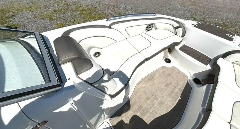 Slide: The Image of The image shows the bow area of a 2013 Yamaha 242 Limited S boat with cushioned seating. - 25