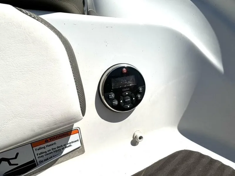 Slide: The Image of Close-up of a boat control panel with a round control unit and a warning label. - 10