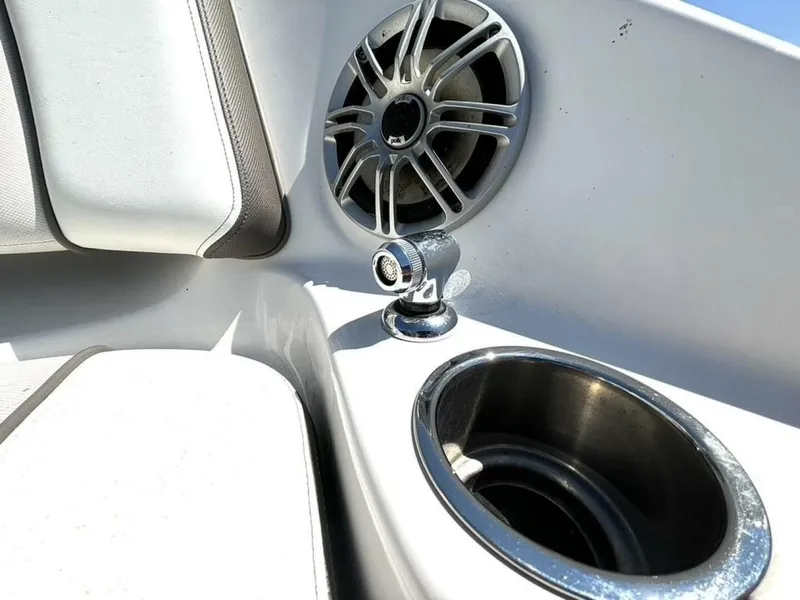 Slide: The Image of Close-up of a speaker and cup holder on a Yamaha 242 Limited S boat. - 11