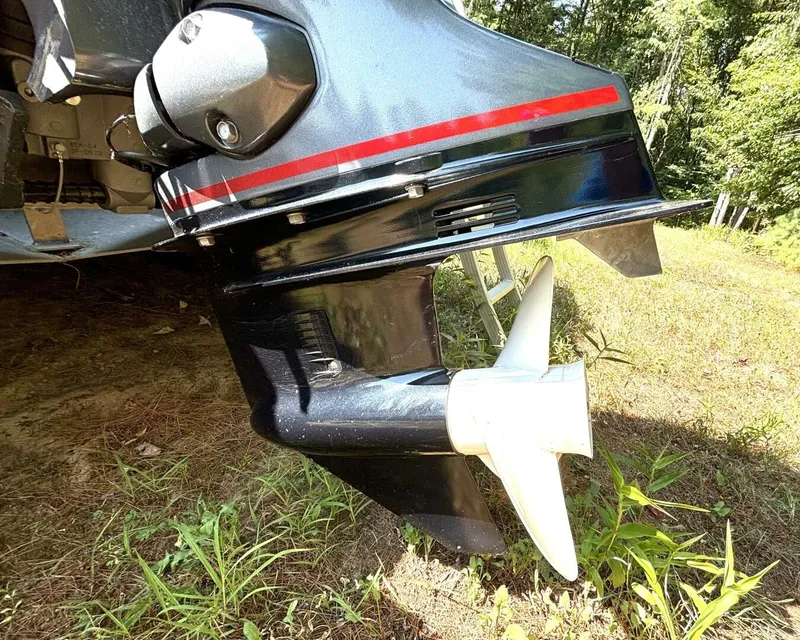 Slide: The Image of Close-up of a boat propeller on a 2023 Bennington 21 SXSAPG, parked on grass. - 29