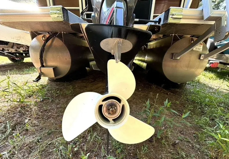 Slide: The Image of Close-up of a boat propeller with two pontoons in the background. - 34