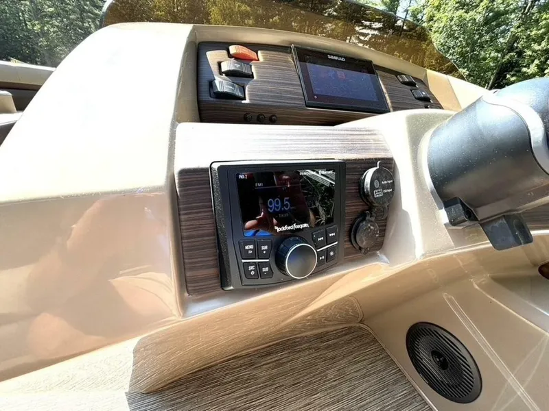 Slide: The Image of The image shows the dashboard of a Bennington 21 SXSAPG boat with modern controls. - 20