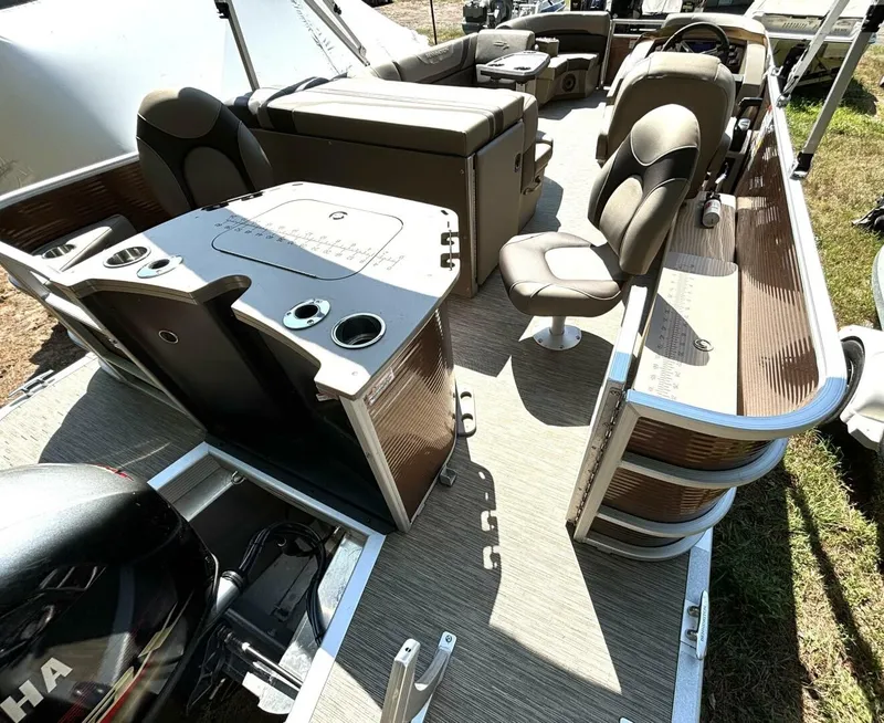 Slide: The Image of The image shows the interior of a 2023 Bennington 21 SXSAPG pontoon boat with sleek seating. - 8