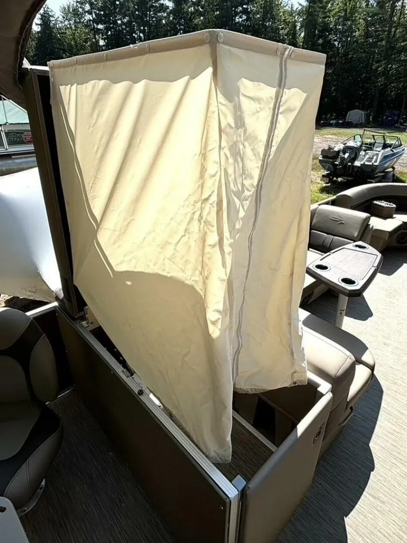 Slide: The Image of A sunshade on a Bennington 21 SXSAPG pontoon boat, surrounded by seating. - 14
