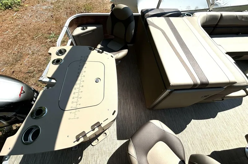 Slide: The Image of The image shows the deck of a 2023 Bennington 21 SXSAPG with seating and a helm console. - 9