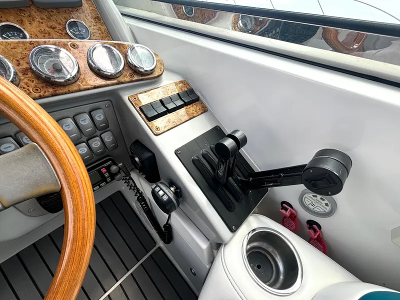 Slide: The Image of The 2006 Formula 400 Super Sport cockpit features a sleek dashboard with wood accents and modern controls. - 30