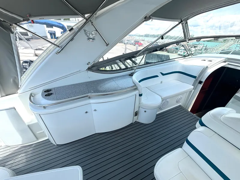 Slide: The Image of The image shows the cockpit of a 2006 Formula 400 Super Sport with sleek white seating and gray flooring. - 21