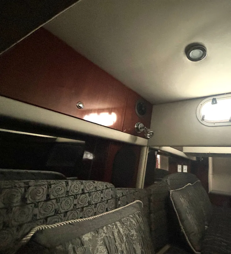 Slide: The Image of Interior of a 2006 Formula 400 Super Sport with cushioned seating and wooden walls. - 47