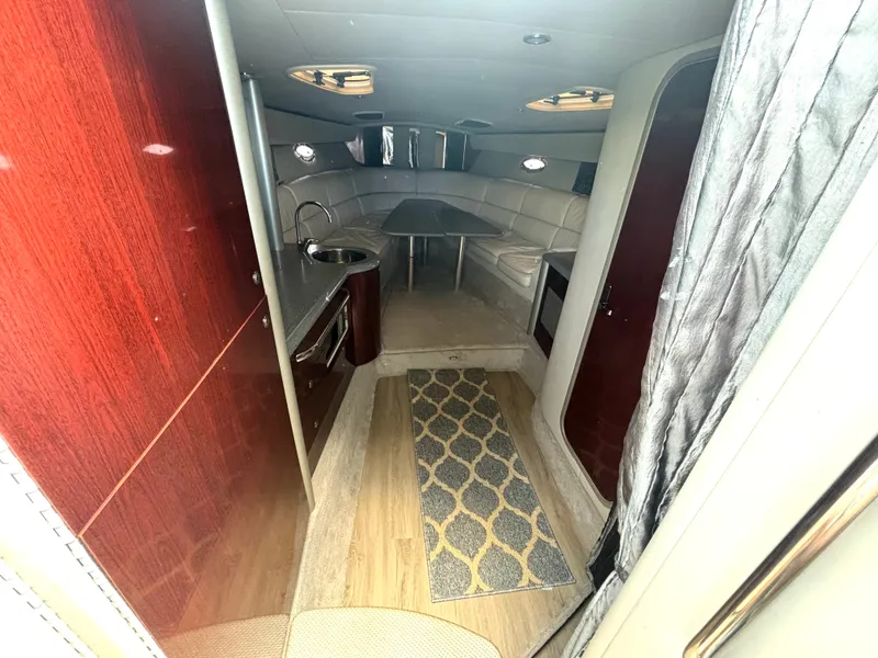 Slide: The Image of Interior of a 2006 Formula 400 Super Sport with elegant wood paneling and a cozy seating area. - 35