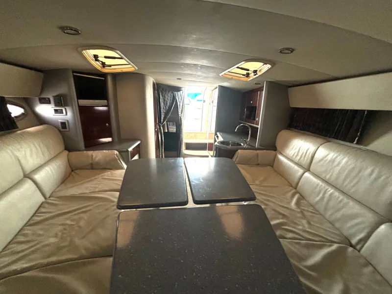 Slide: The Image of Interior of a 2006 Formula 400 Super Sport with beige leather seating and a table. - 42
