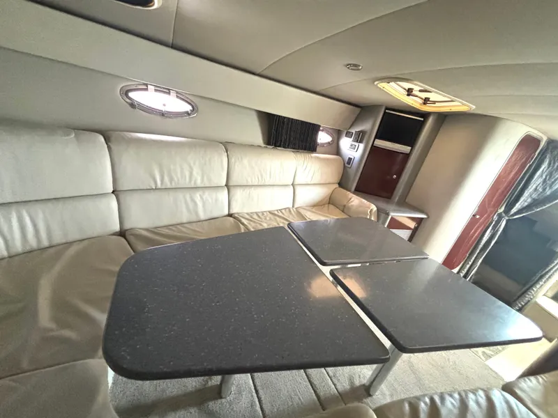 Slide: The Image of Interior of the 2006 Formula 400 Super Sport with beige leather sofa and dark table. - 41