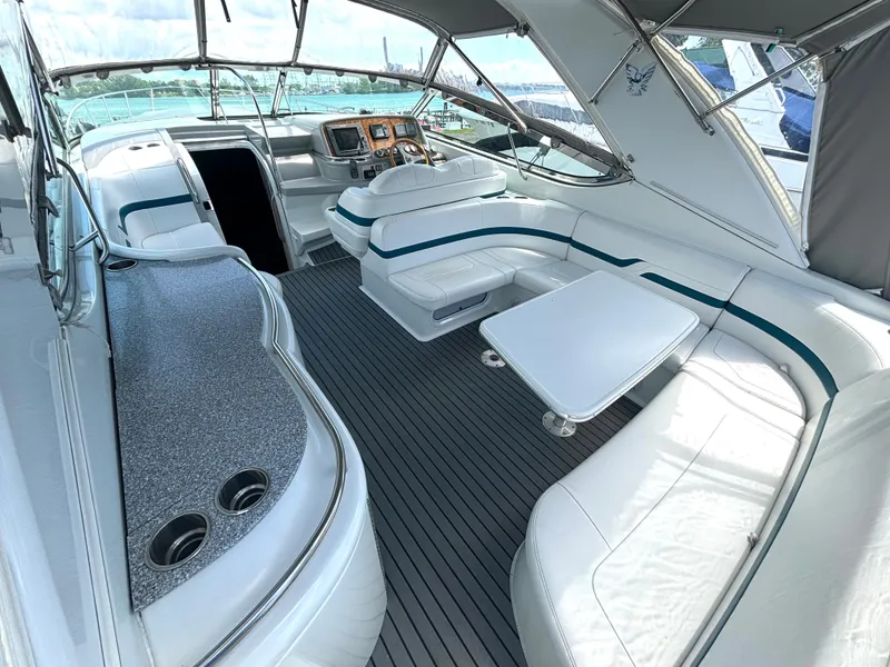 Slide: The Image of The image shows the cockpit of a 2006 Formula 400 Super Sport with sleek white seating and helm. - 18