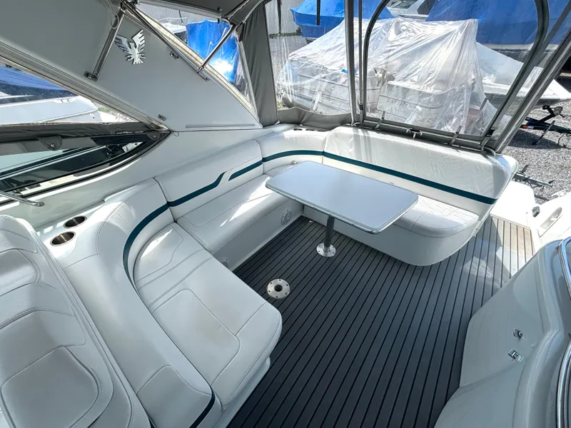 Slide: The Image of The image shows the interior of a 2006 Formula 400 Super Sport with white leather seating and a table. - 19