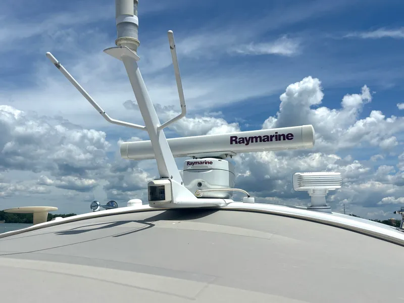 Slide: The Image of Radar antenna on a boat under a blue sky with clouds. - 13