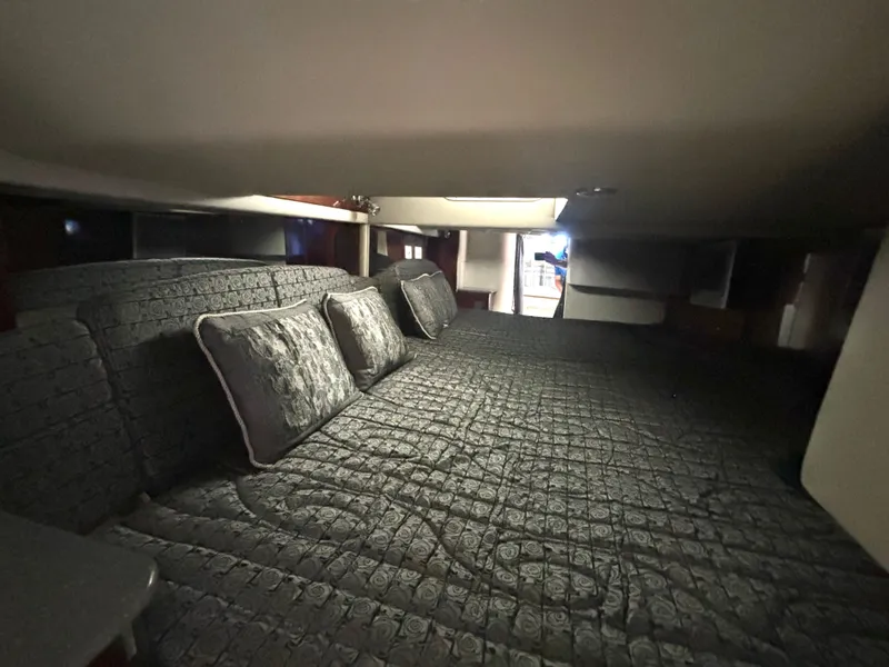 Slide: The Image of The interior of a 2006 Formula 400 Super Sport with a large, cushioned sleeping area. - 45